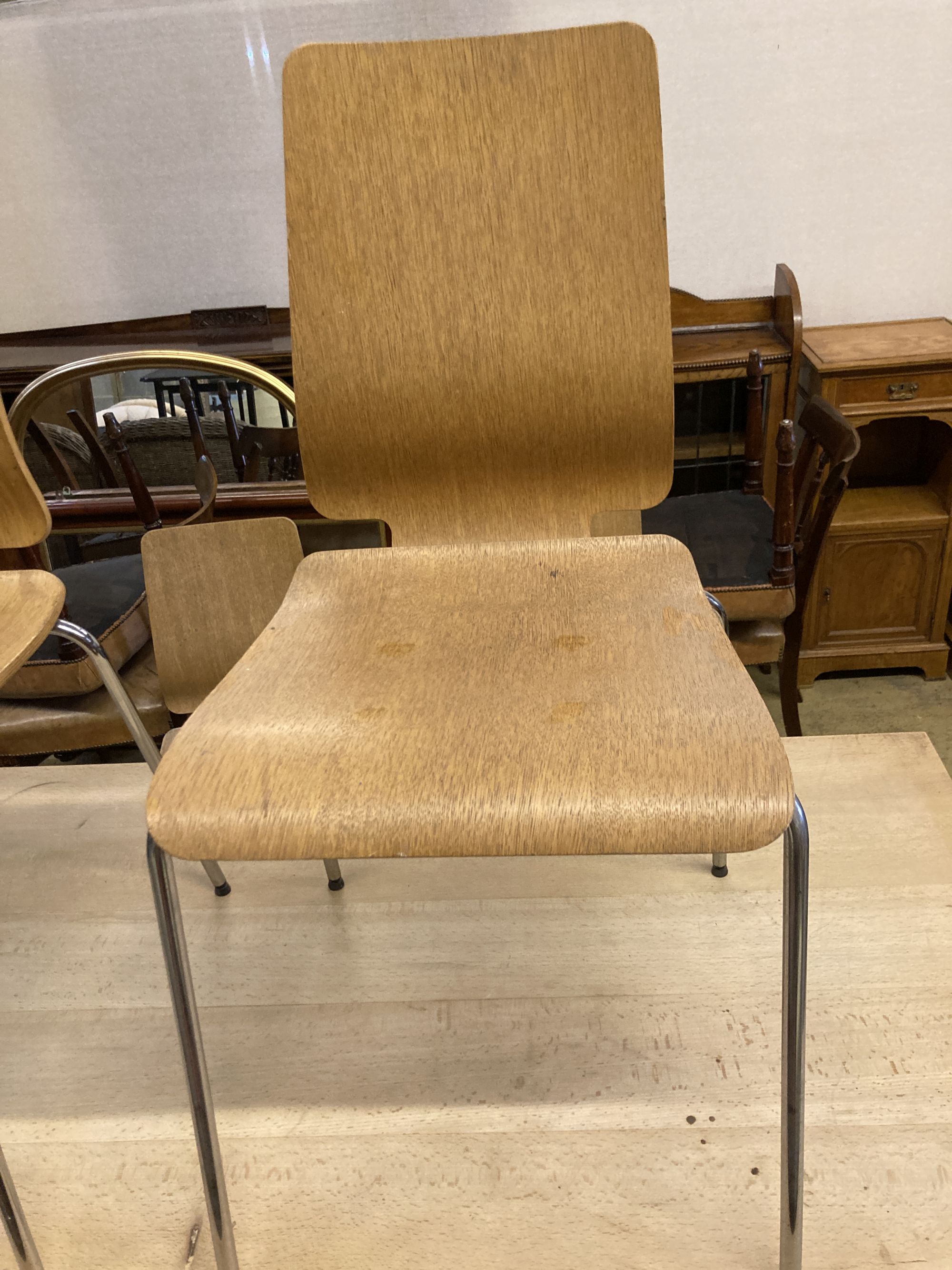 A set of four mid century design bentwood and chrome dining chairs